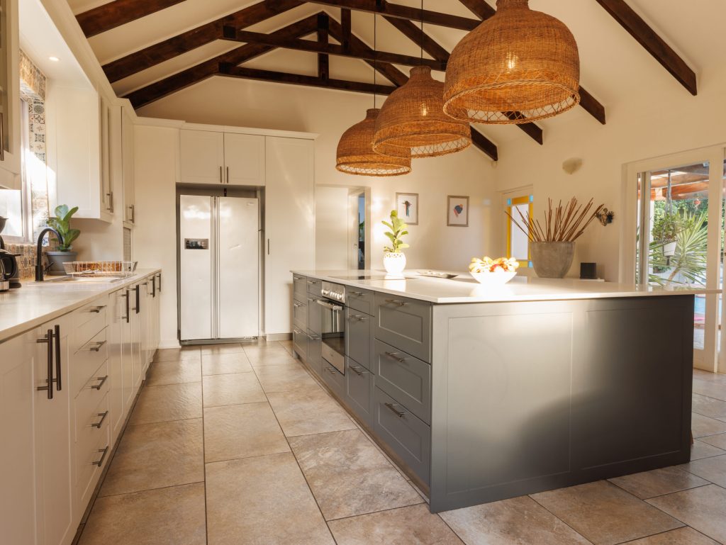 General view of modern kitchen with countertop and kitchen equipment. House interior and design concept.